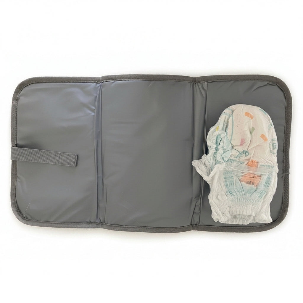 Foldable wipe-clean changing mat included with NestnGo changing bag — Grey