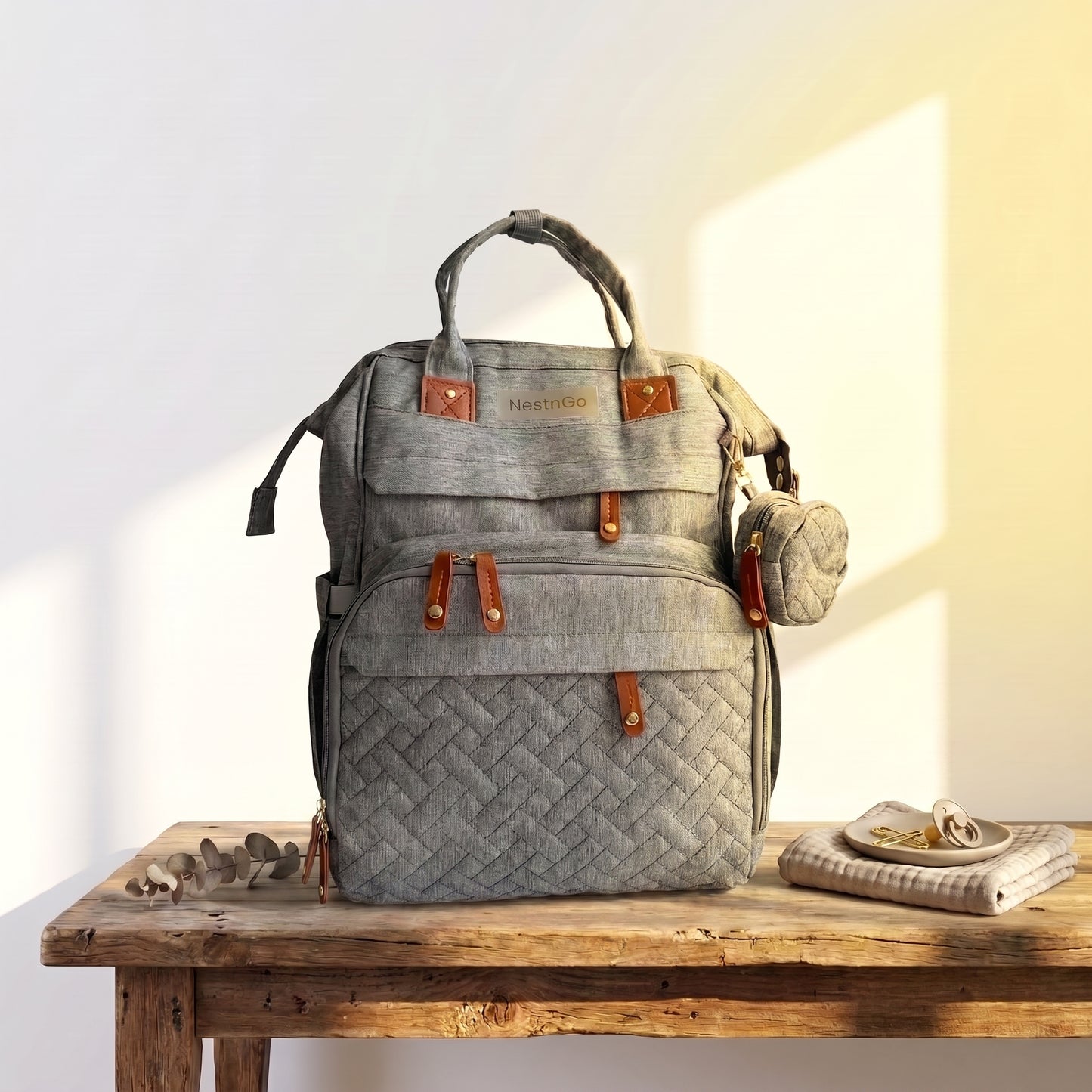 nappy bag on a table front view Grey