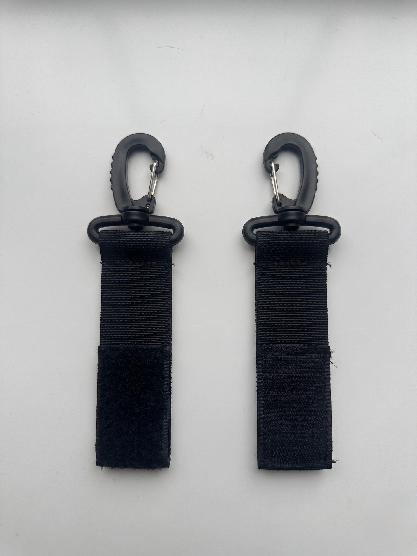 NestnGo pram clips — included attachment clips for hands-free use on any UK pushchair