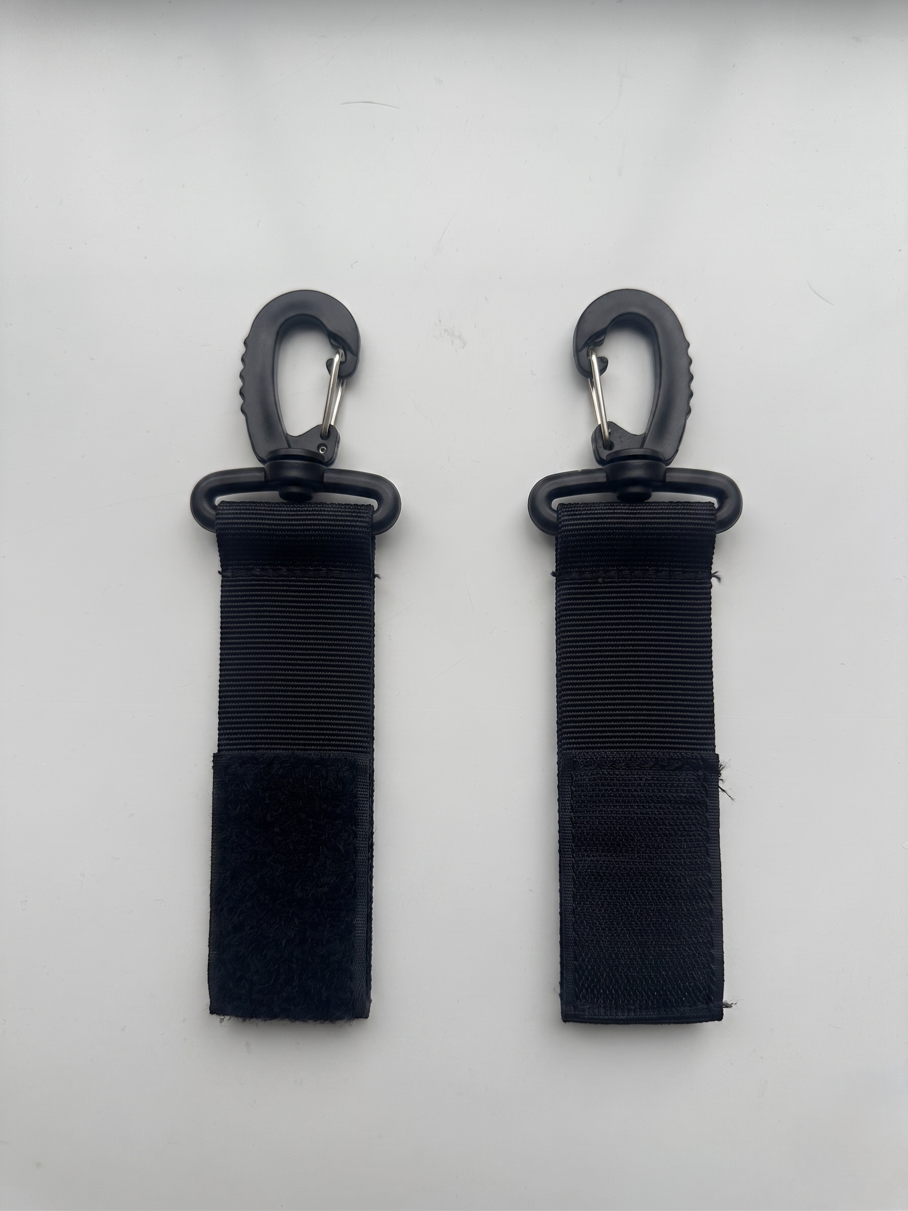 NestnGo pram clips — included attachment clips for hands-free use on any UK pushchair