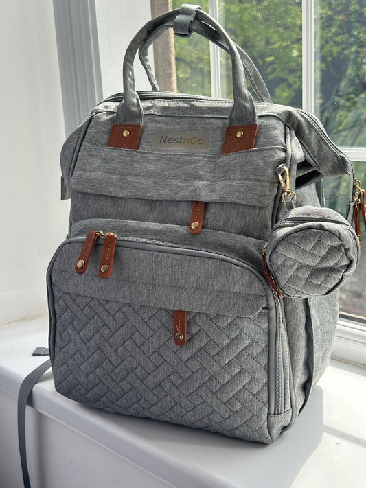 NestnGo 3-in-1 changing bag backpack in grey — front view showing quilted water-resistant fabric