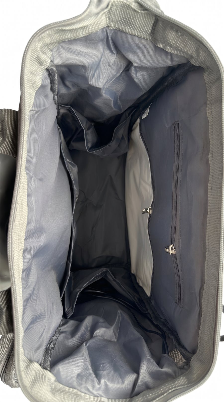 The Grey NestnGo bag seen from above, open and empty, with each inside pocket numbered